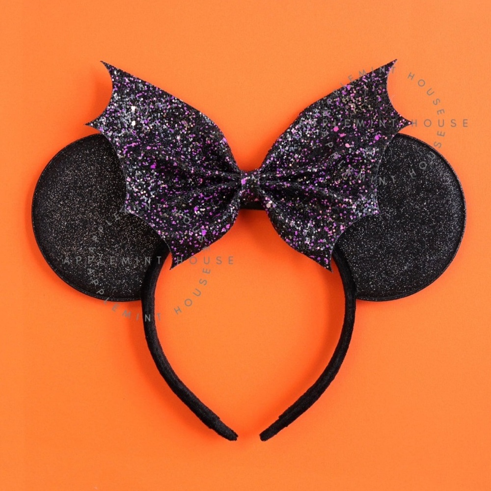 Never worn, still in plastic packaging Halloween ears.